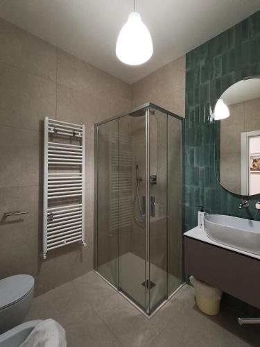 a bathroom with a shower and a sink and a toilet at Hotel La Caravella in Bellaria-Igea Marina