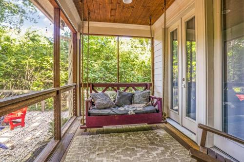 a screened in porch with a couch on the front at Musician's Ranch in Franklin