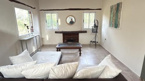 a living room with a couch and a table at Aurora - calle Del Sol in Santa Rosa