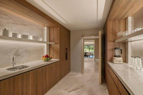 a kitchen with a sink and a counter at The St. Regis Goa Resort in Cavelossim