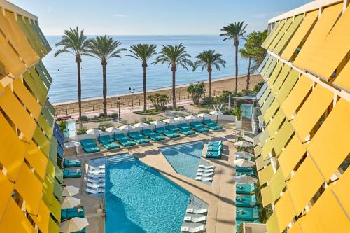 an aerial view of the pool and the beach at W Ibiza in Santa Eularia des Riu