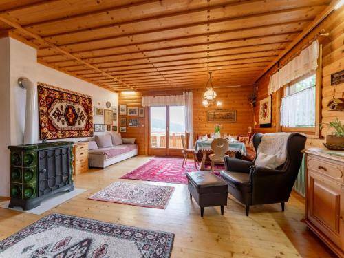 a living room filled with furniture and a wooden ceiling at Landhaus zur Sonne in Diex