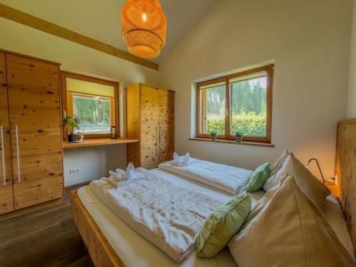 a bedroom with a large bed in a room at Oselitzen 56 in Lake Pressegg