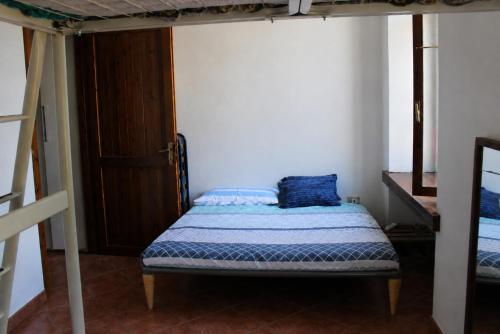 a bed in a room with a bunk bed at Villa Gina in Villar Pellice