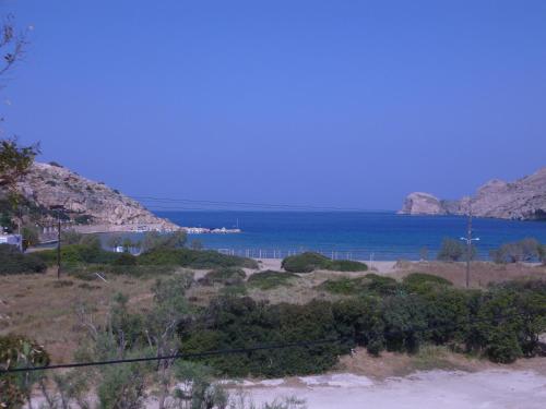 a view of the ocean from a hill at Peter & Tony Rooms in Galissas
