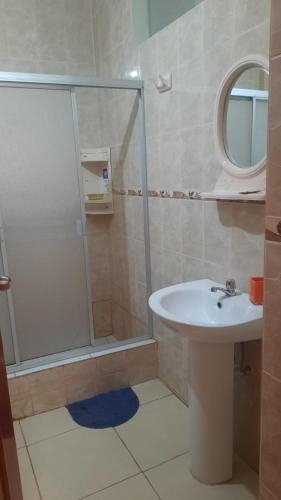 a bathroom with a shower and a sink at Hospedaje Kelita in Moquegua