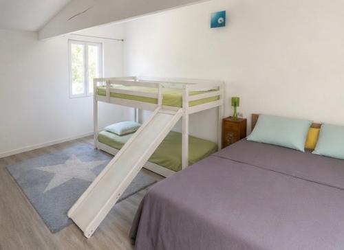a bedroom with a bunk bed and a bunk bedouble at Cité château de Carcassonne in Berriac