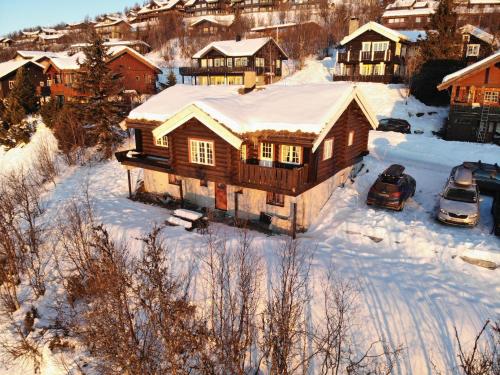 an aerial view of a house in the snow at Ideal For Families 6 Bedrooms And Sauna in Beitostøl