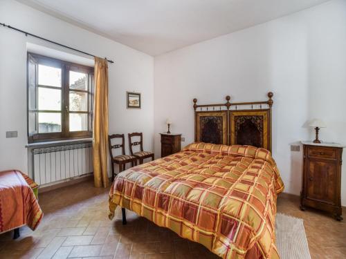 a bedroom with a bed and a window at Mansion in Citerna with Pool & Garden in Citerna