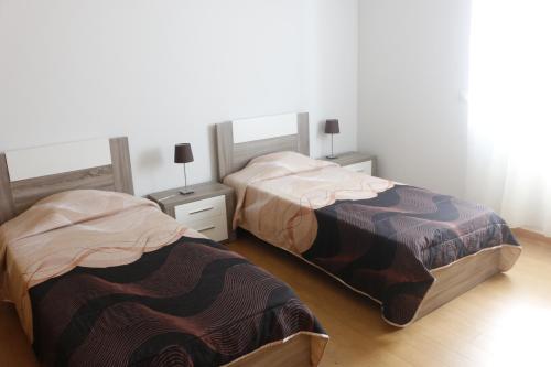 Posteľ alebo postele v izbe v ubytovaní Cantinho Das Praias