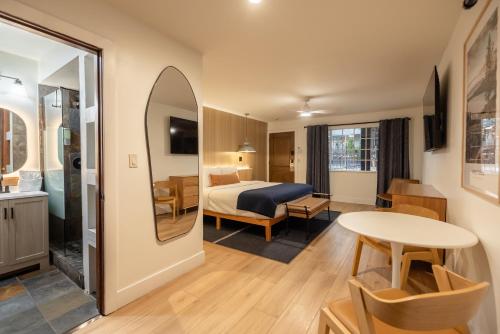 a hotel room with a bed and a table at The Iceberg Tahoe in South Lake Tahoe
