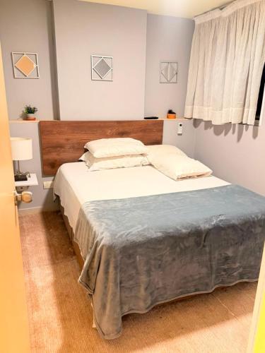 a bedroom with a large bed in a room at Sky Luxury Suites in Bucaramanga