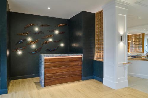 a kitchen with a fish mural on the wall at OUTRIGGER Kaua'i Beach Resort & Spa in Lihue
