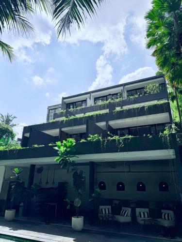 a building with plants on the top of it at The CIVYT in Ubud