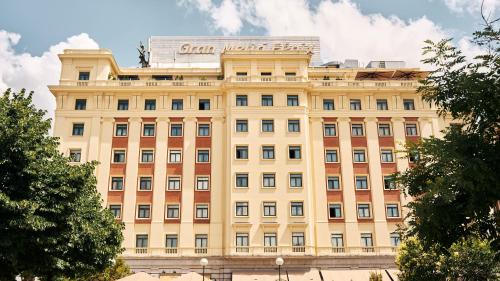 a building with a sign on the top of it at Hotel Fénix, a Gran Meliá Hotel - The Leading Hotels of the World in Madrid