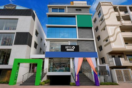 a building with a mieo sign in front of it at Hotel O Satyam Junction Seethammadhara in Visakhapatnam