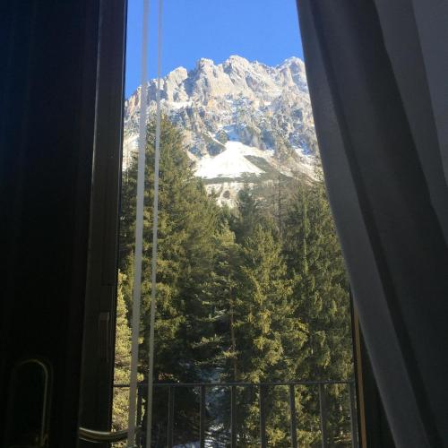 a view of a mountain from a window at TH Borca di Cadore - Park Hotel Des Dolomites in Borca di Cadore