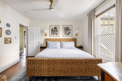 a bedroom with a large bed and a window at Nashville Fatherland Cottage in Nashville