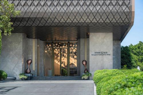 a building with a glass door in front of it at INNSiDE by Meliá Bangkok Sukhumvit in Bangkok