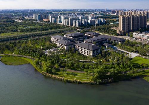 an aerial view of a building next to the water at Gran Meliá Chengdu in Chengdu