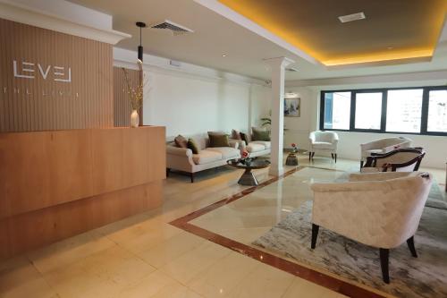 a living room with a couch and a table and chairs at Meliá Lima in Lima