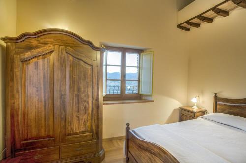 Postel nebo postele na pokoji v ubytování La Castellaia Resort