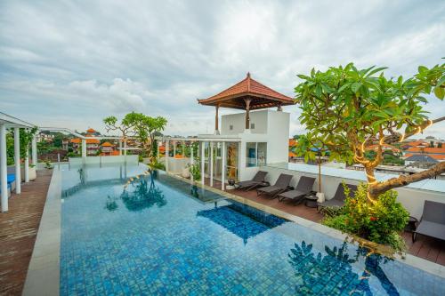 a view of a swimming pool at a hotel at Kuta Beach Hotel in Kuta