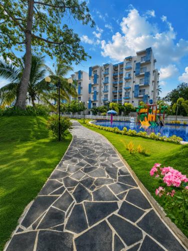 a walkway in a park with a playground at Signature 2BR - Deluxe - Santorini - Negombo in Negombo