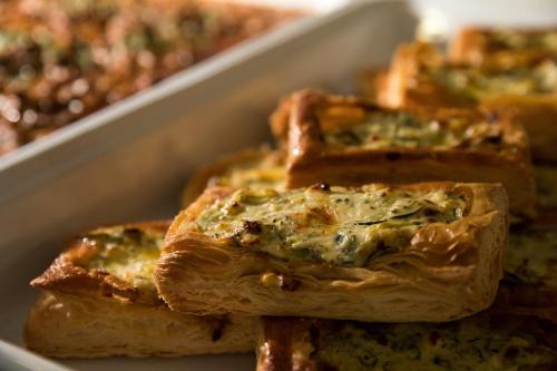 a close up of a tray of food with bread at Vincent House London Residence in London
