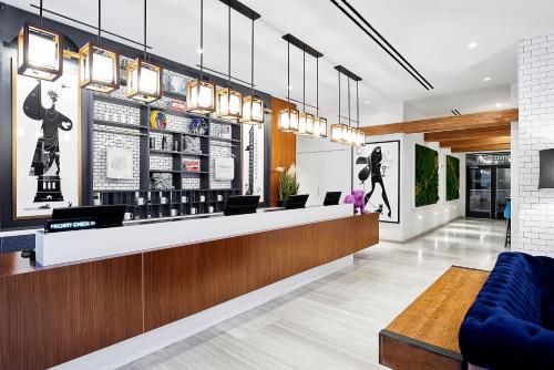 a lobby of a store with a counter and chairs at INNSiDE by Meliá New York Nomad in New York