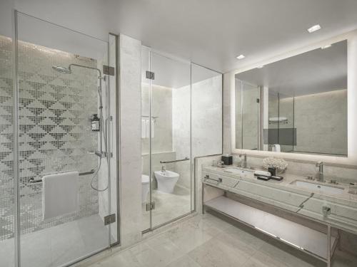a bathroom with a shower and a sink and a toilet at Jabal Omar Hyatt Regency Makkah in Mecca