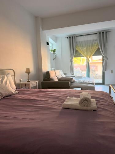 a bedroom with a bed with a towel on it at The nest in Kalavrita