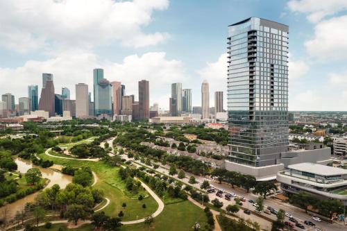 an aerial view of a city skyline with a tall building at Thompson Houston, by Hyatt in Houston