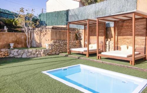 a backyard with a swimming pool and a gazebo at Spacious House in Can Trabal in Can Trabal