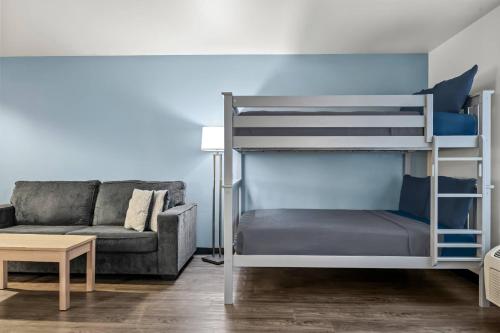 a living room with a bunk bed and a couch at Big Horn Resort, an Ascend Collection Hotel in Billings