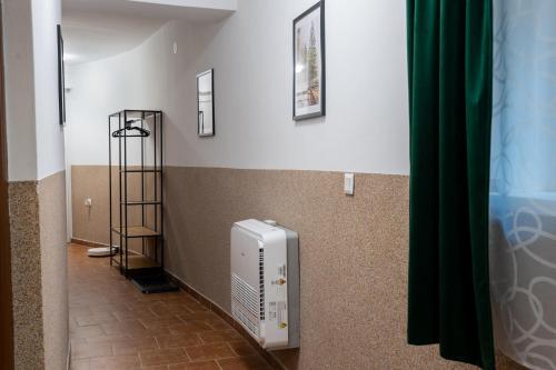 a room with a heater on the wall at Green House in Banka