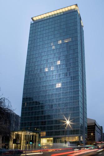 a tall glass building with a street in front of it at INNSiDE by Meliá Milano Torre GalFa in Milan
