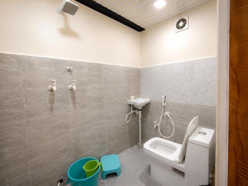 a bathroom with a toilet and a shower at Hotel Diamond inn Mathura in Mathura