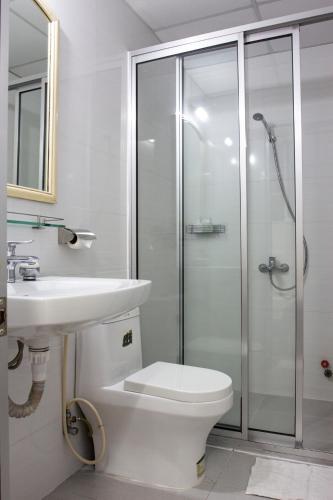 a bathroom with a toilet and a sink and a shower at QUANG SAIGON Hotel- 40-7 Bùi Viện-Walking street in Ho Chi Minh City