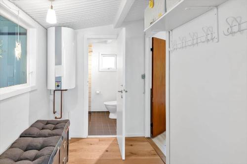 a bathroom with a bed and a toilet in a room at 14231-1-Grevinge-Kirsebaerhaven-18 in Grevinge