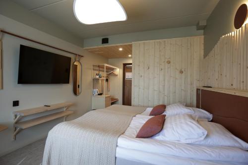Postel nebo postele na pokoji v ubytování Hotel Inari