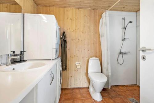 a bathroom with a toilet and a sink and a shower at FJ1601-Jaegerspris-Strandleddet-25 in Jægerspris