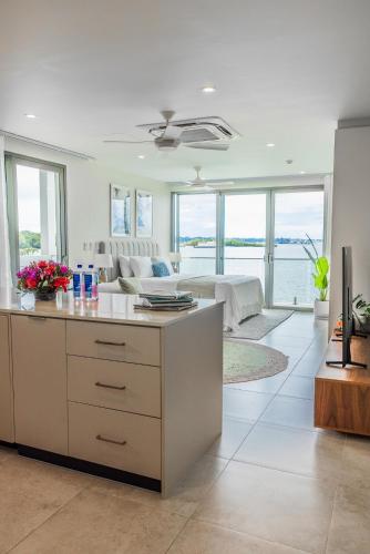 a living room with a couch and a table at 307 - Suva City Views Oceanfront Large Balcony in Suva