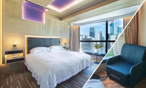 a bedroom with a large bed and a blue chair at The Emperor Hotel in Hong Kong