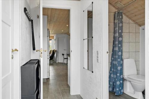 a hallway with a bathroom with a toilet and a sink at LF12172-Vinderup-Strandlyst-29 in Vinderup