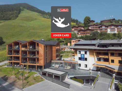 a rendering of a house in a city at Saalbach Suites by ALPS RESORTS in Saalbach-Hinterglemm