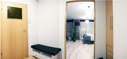 a door leading into a room with a bedroom at Magnetic Studio Odkryta in Warsaw