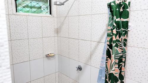 a shower with a shower curtain in a bathroom at Auki Ocean View in Auki