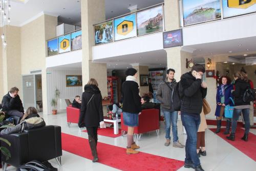a group of people standing in a store at Hotel Dosco in Van