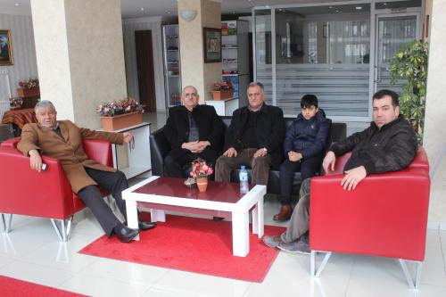 a group of people sitting on red chairs at Hotel Dosco in Van